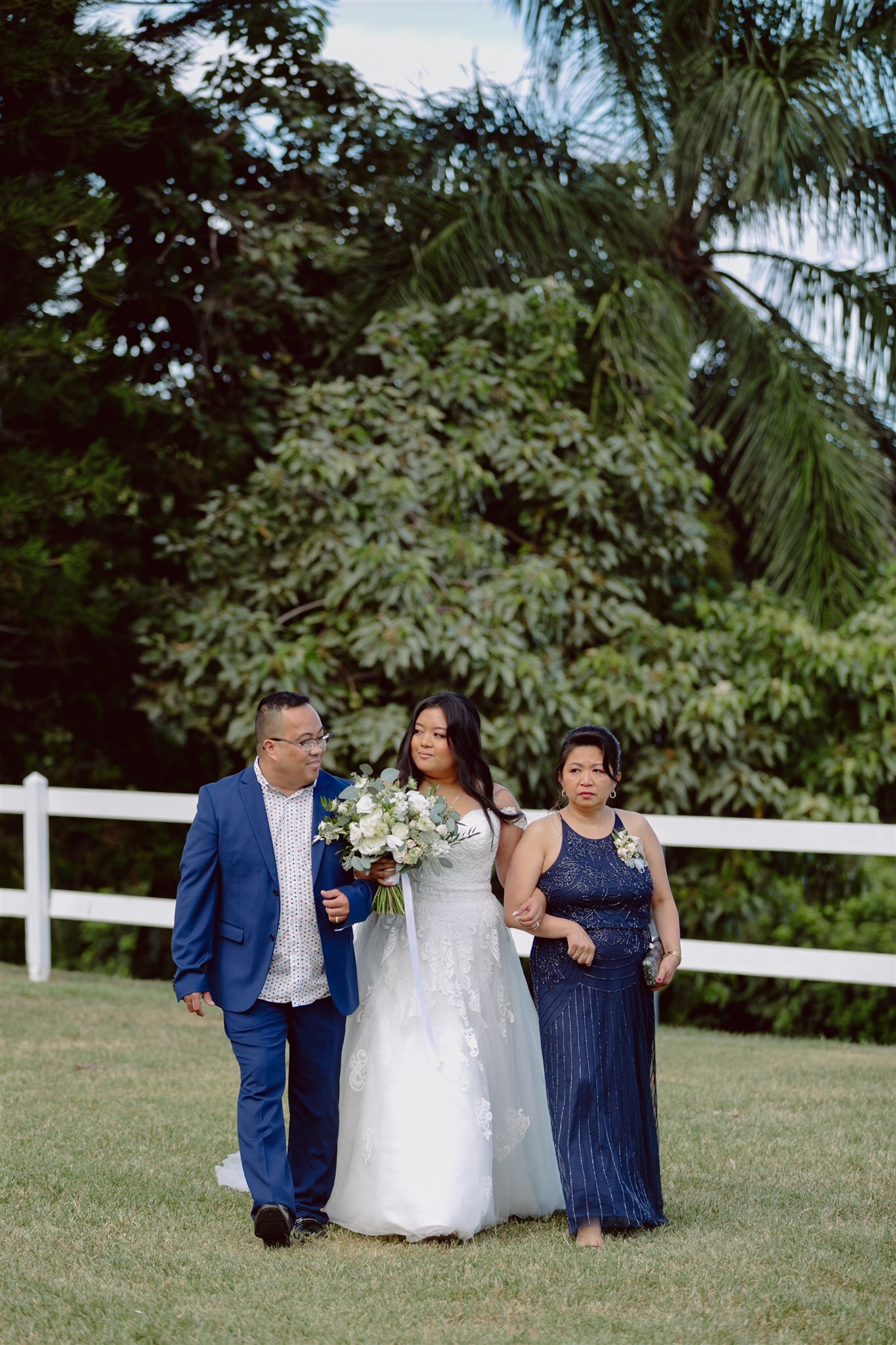 paliku-gardens-destination-wedding-processional-bride-parents.jpg