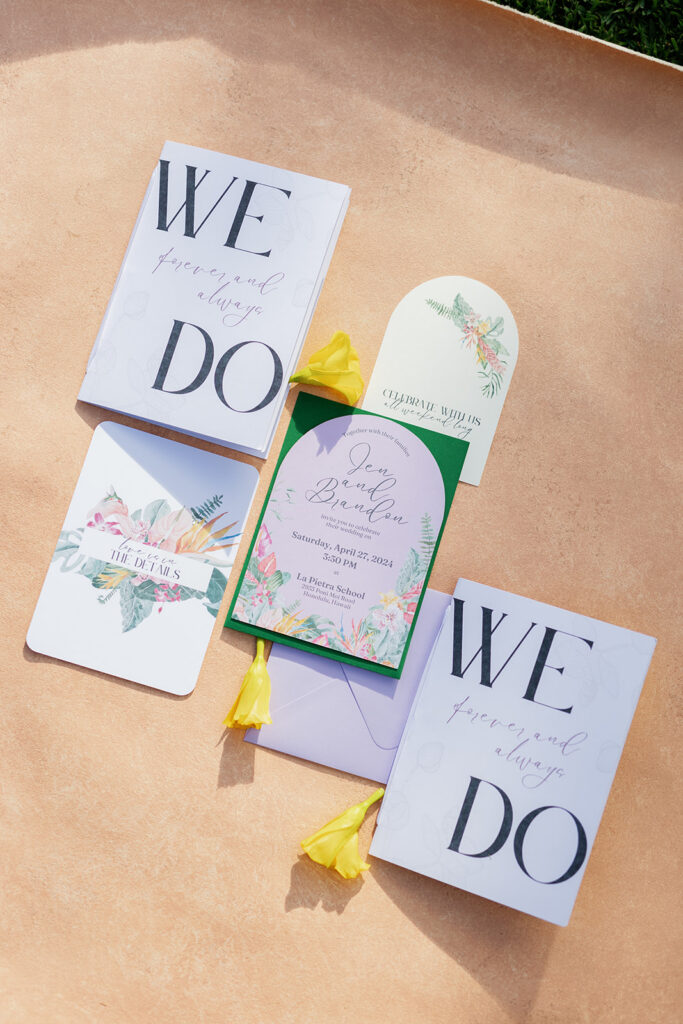 a wedding flat lay with wedding invitations and yellow flowers 