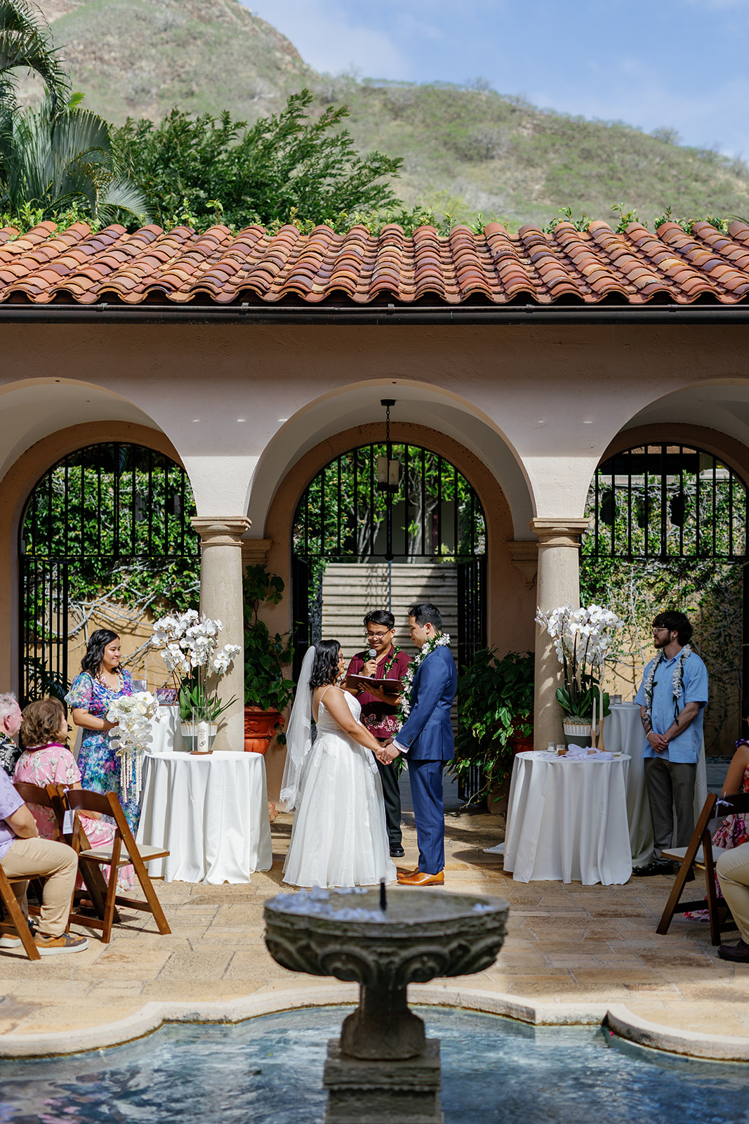 a couple holding hands and looking at each other they are having their wedding ceremony at la pietra school 