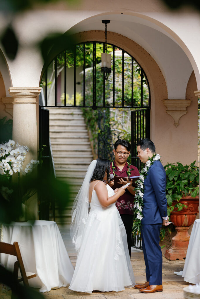 a couple having their wedding ceremony at la pietra school 