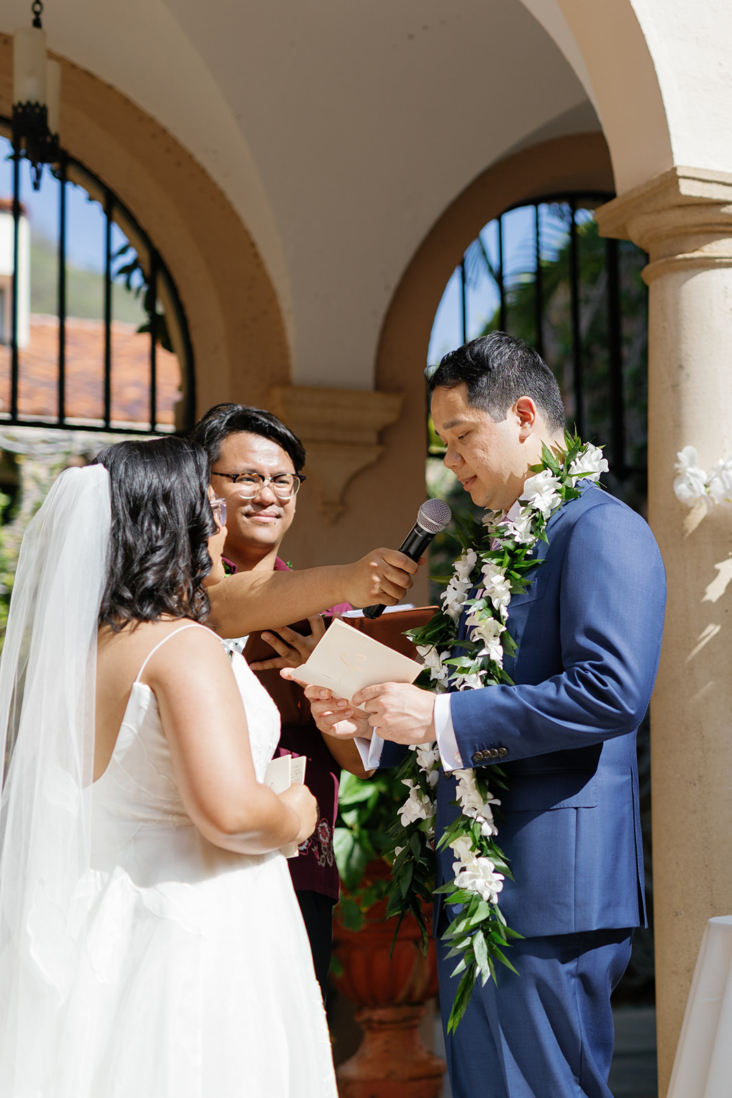 a groom reading vows to his bride at their wedding in la pietra school