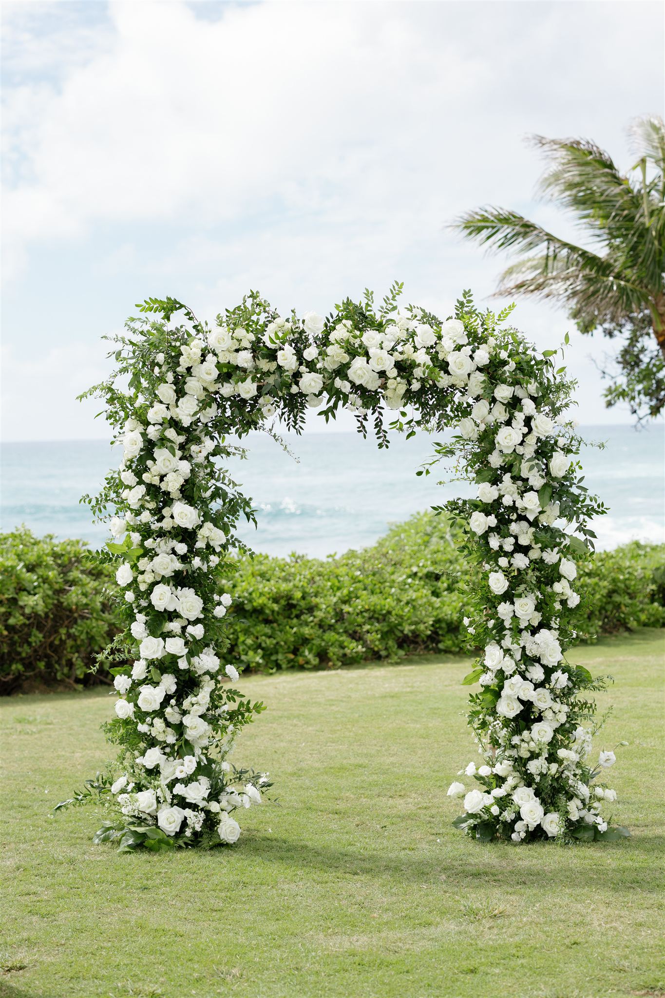 a floral wedding arch set up for a wedding ceremony at Ritz-Carlton O'ahu, Turtle Bay