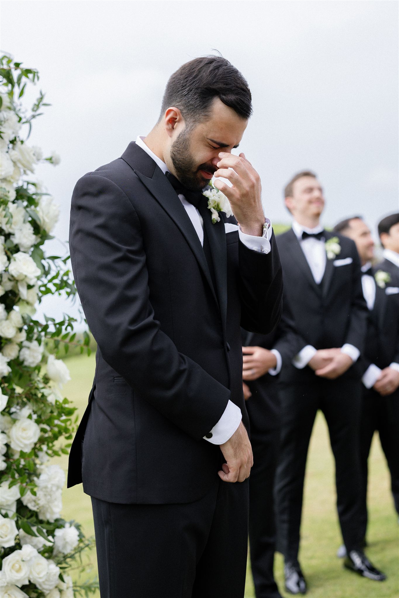 a groom crying at his wedding ceremony