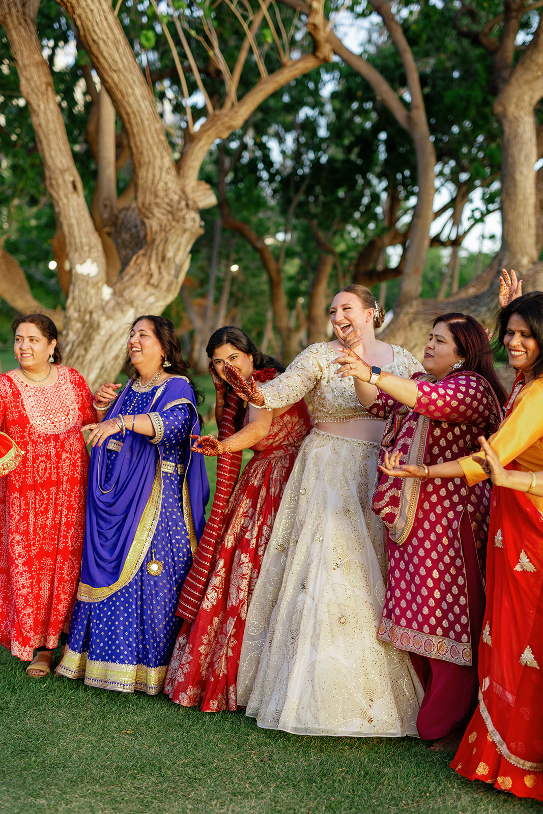 women dancing together at sangeet night at Lanikuhonua Cultural Institute in Kapolei, HI,