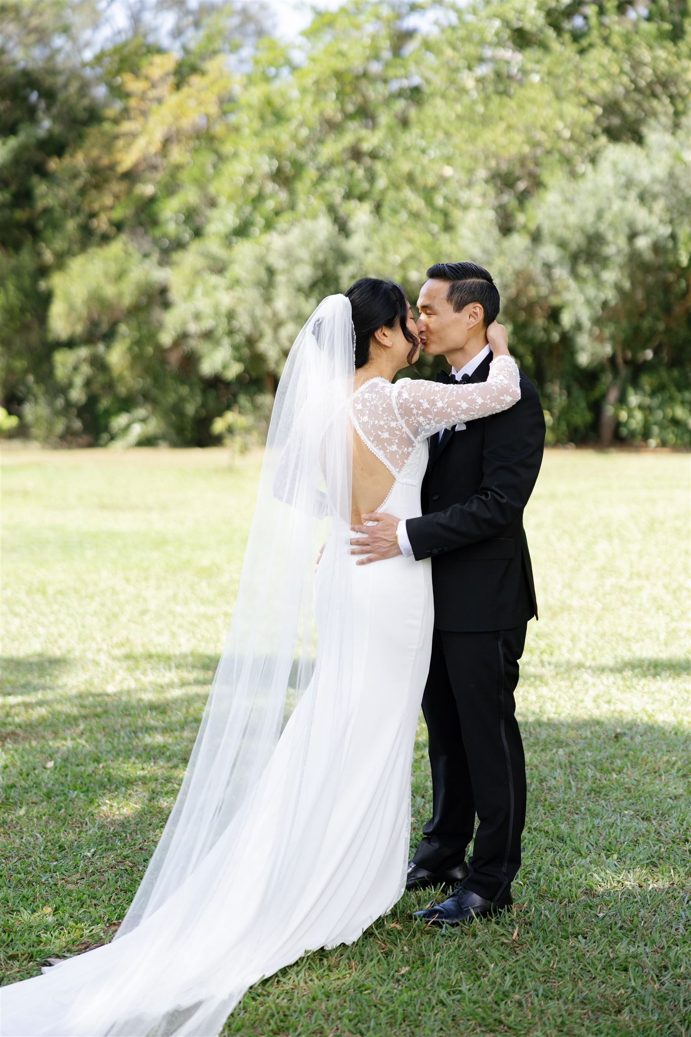 a bride and groom kissing each other 