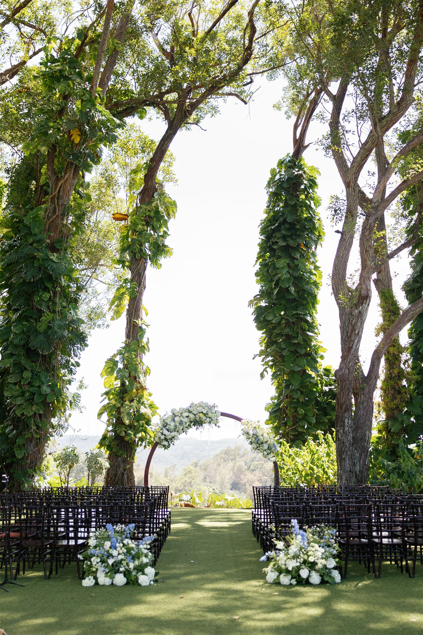 an arch and chairs set up for a wedding at sunset ranch in hawaii
