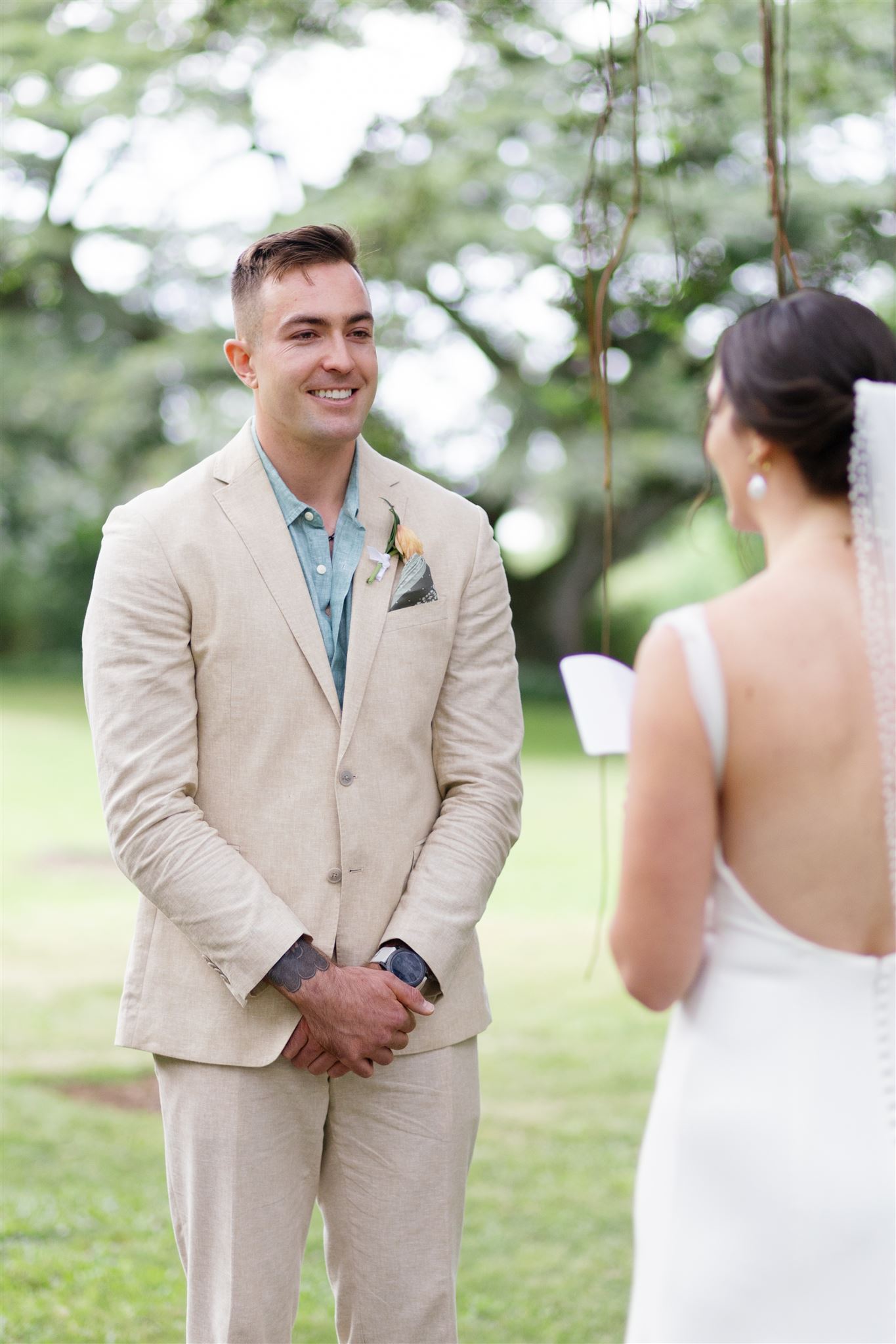 a bride reading vows to her partner at their wedding ceremony