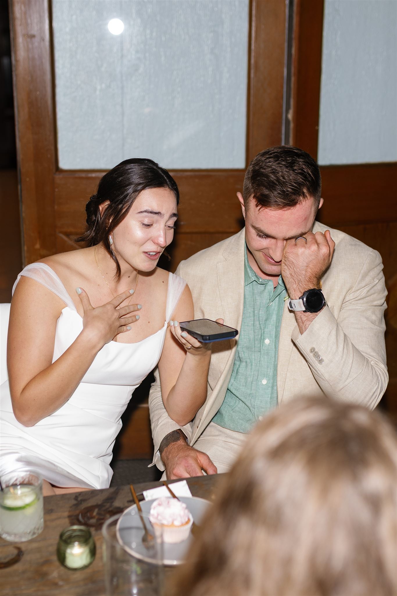 a bride and groom getting emotional at their wedding reception at proud peacock in waimea valley