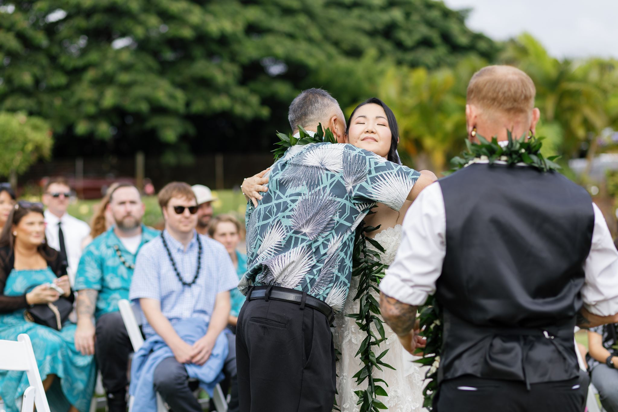 a bride hugging her father before her weddding ceremony