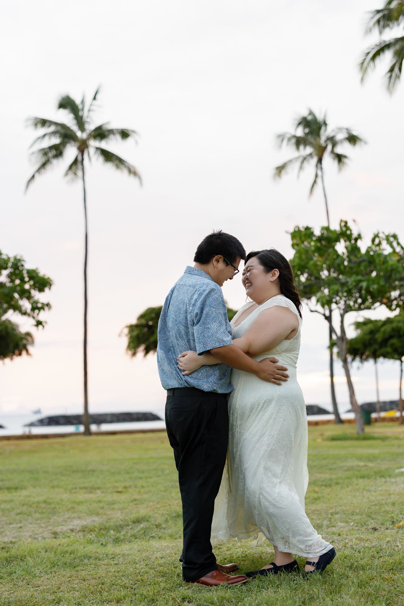 a man and woman embracing and laughing together