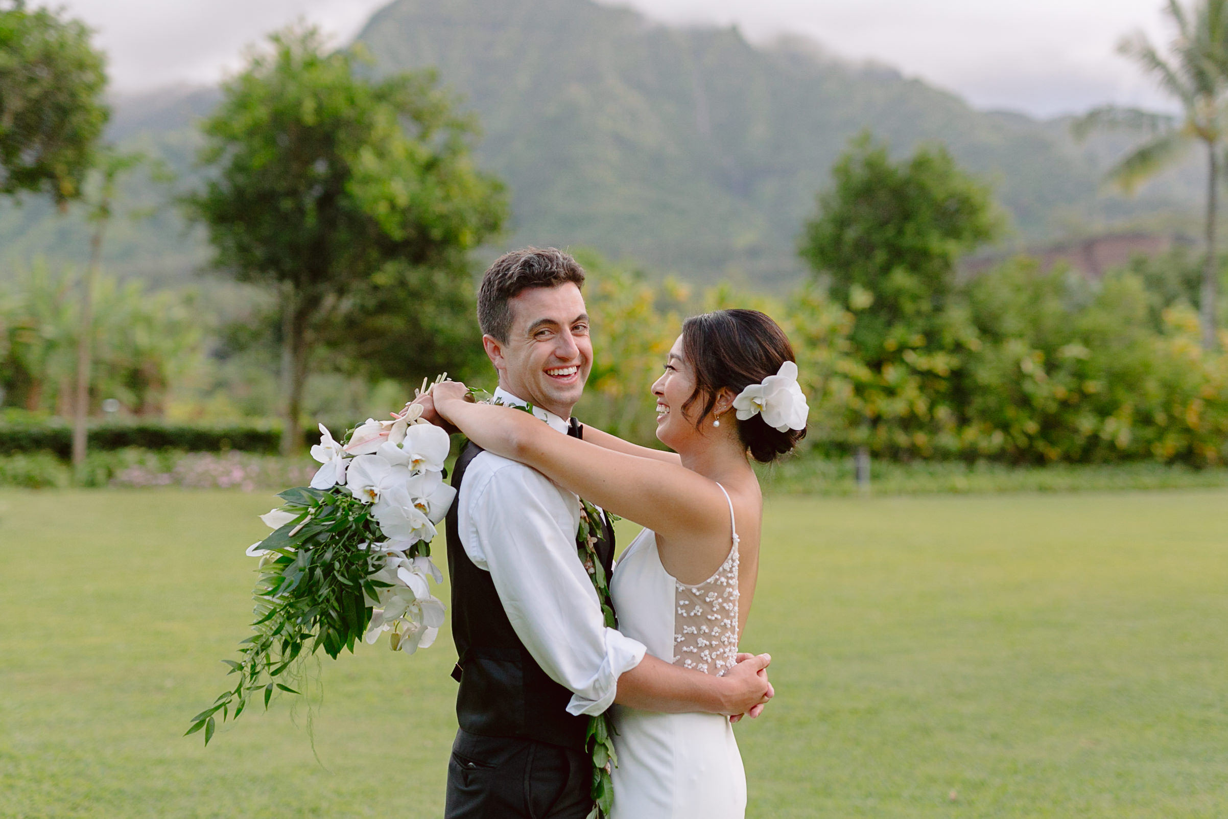 bride and groom portrait in front of Kauai mountain